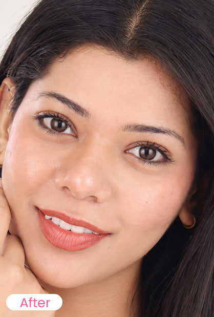 Close-up portrait of a woman with dark hair and warm skin tone